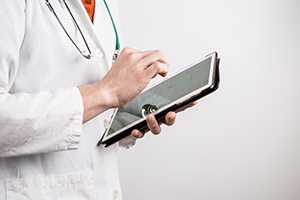 Doctor with tablet computer